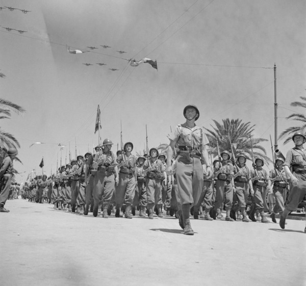 French Troops Passing Reviewing Stand in Allied Victory Parade along Avenue Gambetta as American Planes Fly Overhead in Show of Allied Might, Tunis, Tunisia, Marjorie Collins for Office of War Informa...
