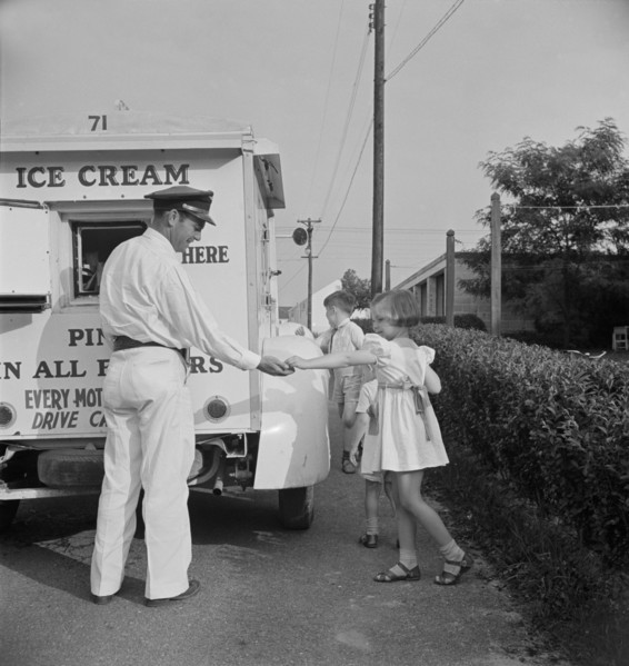 Young Girl Buying Ice Cream from Good Humor Man at Federal Housing Project, Greenbelt, Maryland, USA, Marjorie Collins for Farm Security Administration, June 1942