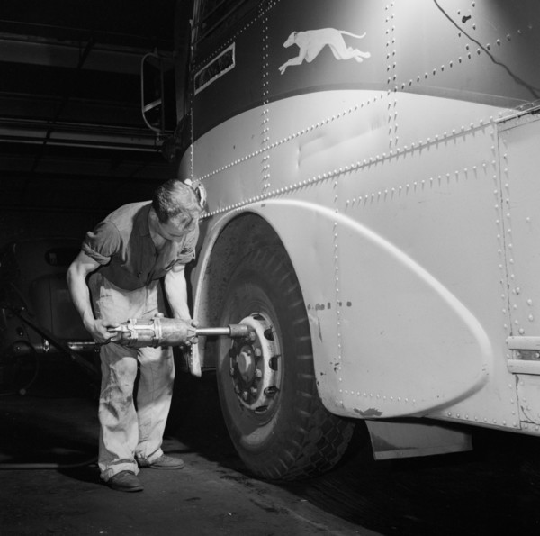 Mechanic Removing Tire from Bus at Greyhound Garage, Pittsburgh, Pennsylvania, USA, Esther Bubley for Office of War Information, September 1943