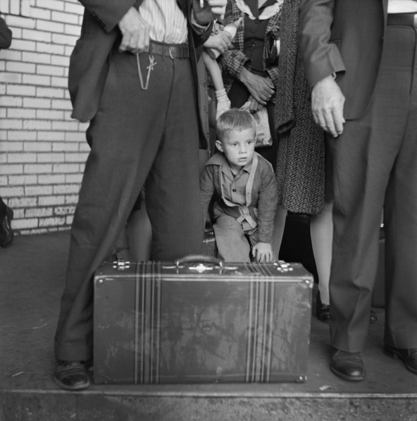 Young Boy with Group of People Waiting for Greyhound Bus during Trip from Louisville, Kentucky to Memphis, Tennessee, USA, Esther Bubley for Office of War Information, September 1943
