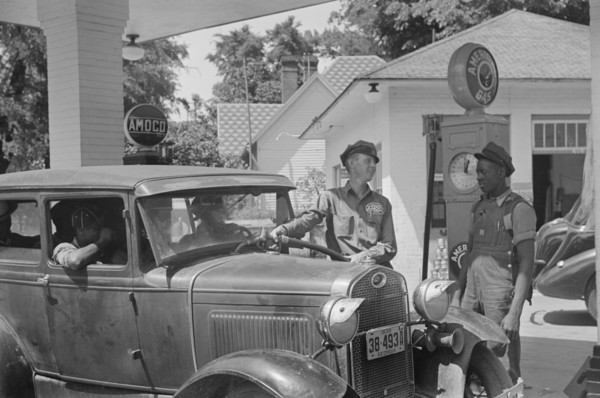Gas Station Attendant Filling Car with Gasoline, Atlanta, Georgia, USA, Marion Post Wolcott for Farm Security Administration, June 1939