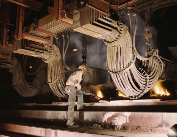 Worker at Large Electric Phosphate Smelting Furnace used in Making of Elemental Phosphorus in TVA Chemical Plant, near Muscle Shoals, Alabama, USA, Alfred T. Palmer for Office of War Information, June...