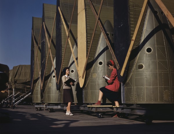 Female Inspectors Making Notes while Checking Cargo Transport Inner wings before Assembly on Fuselage, Douglas Aircraft Company, Long Beach, California, USA, Alfred T. Palmer for Office of War Informa...