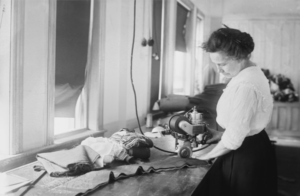 Woman Cutting Flag Stripes for American Flags, Brooklyn Navy Yard, Brooklyn, New York, USA, Bain News Service, July 1917