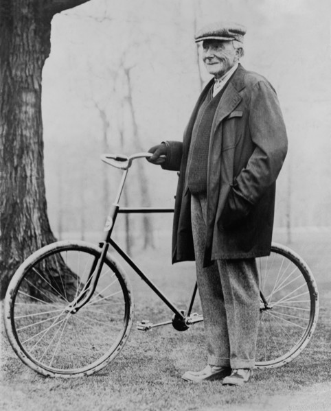 John D. Rockefeller (1839-1937), Portrait standing with Bicycle, 1913