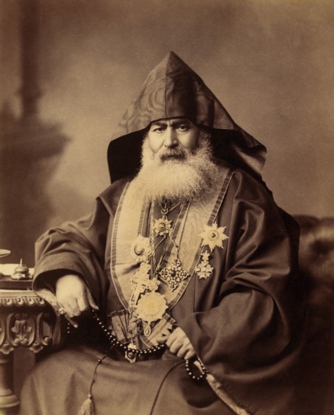 Armenian Patriarch of Jerusalem, Harootiun Vehabedian, Seated Portrait Wearing Hooded Vestment, Adorned with Crosses and other Medals, Holding a Strand of Beads, Jerusalem, American Colony Photo Depar...