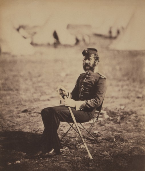 British Major Percy Archer Butler, Seated Portrait in Uniform and Holding Sword with Military Tents in Background, Crimean War, Crimea, Ukraine, by Roger Fenton, 1855