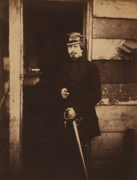 British Captain Francis Baring, Fusilier Guards, Deputy Assistant Quartermaster General, attached to the Light Division, Portrait Standing in Uniform with Hand on Sword at Entrance of Wood Building, C...
