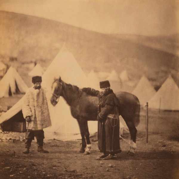 British Colonel Alexander Low, 4th Light Dragoons, Full-Length Standing Portrait in Winter Uniform with Servant and Horse, Military Tents in Background, Crimean War, Crimea, Ukraine, by Roger Fenton, ...