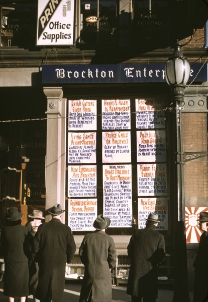 Men and Women Reading Headlines Posted in Street-Corner Window of Brockton Enterprise, Newspaper Office on Christmas Eve, Brockton, Massachusetts, USA, Jack Delano for Farm Security Administration - O...