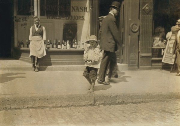 Willie Hutchinson, 6-yearl-old Newsie, Full-Length Portrait on Sidewalk, Richmond, Virginia, USA, Lewis Hine for National Child Labor Committee, June 1911