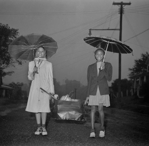 Two Young Girls Carrying Scrap Metal in Rain during Scrap Salvage Campaign, Roanoke, Virginia, USA, Howard Liberman for Office of War Information, October 1942