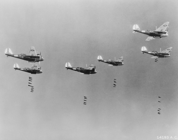 600-pound Bombs falling from Formation of B-10 Bombers in Bombing Practice by 19th Bombardment Group, U.S. Army Air Corps, Office of War Information, early 1940's