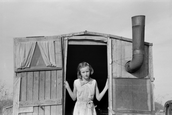 Daughter of Migrant Farmer in Doorway of Trailer, Sebastin, Texas, USA, Russell Lee, Farm Security Administration, February 1939