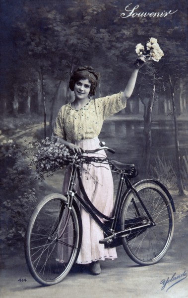 Woman Standing with Bicycle, Hand Colored Photograph, circa 1913