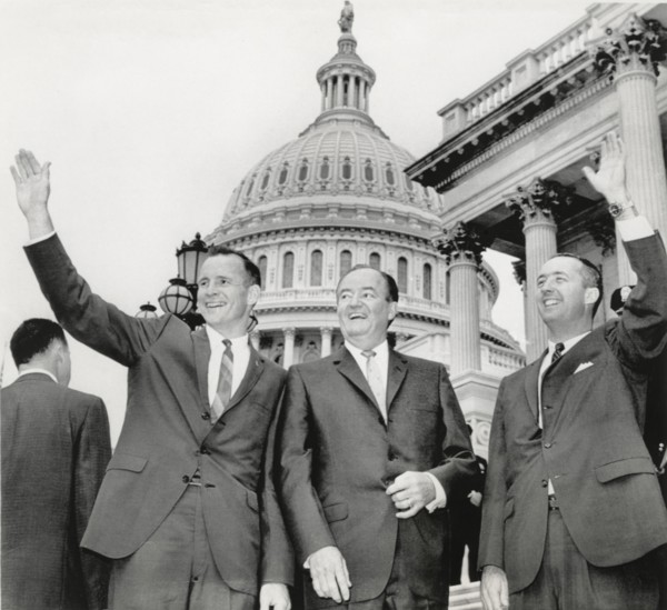 Astronauts Edward White II (L) and James McDivitt (R) with U.S. Vice President Hubert Humphrey on Steps of Capitol Building, Washington DC, USA, 1965