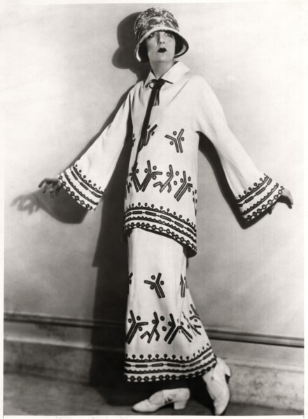 Fashionable Woman in Two-Piece Outfit of White Twill, Applique Motifs and Embroidery with Hat, Portrait, circa 1922