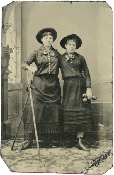 Portrait of Two Young Adult Women, Both Standing in Hats and Long Skirts with Poles, Rings and  Weights, circa 1870