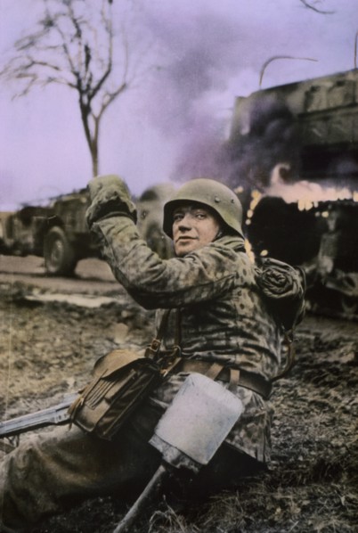 German Soldier Waving Members of his Unit Forward, Ardennes-Alsace Campaign, Battle of the Bulge, 1945