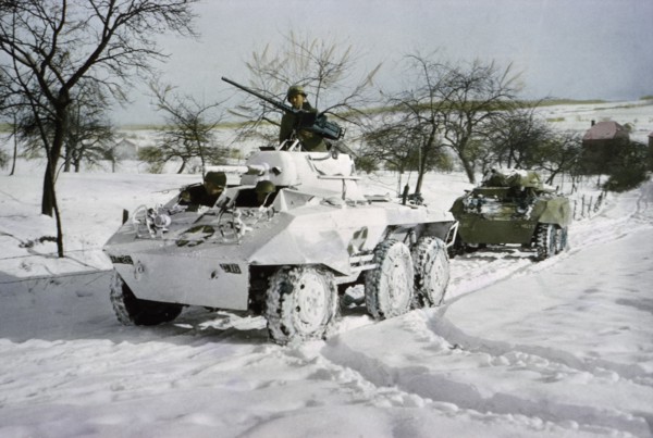 Camouflaged Light Armored Car M8 and one that was not Painted White, Ardennes-Alsace Campaign, Battle of the Bulge, 1945