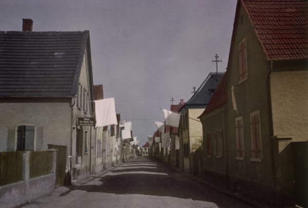 White Flags of Surrender Hang from Buildings in Deserted Street of German Town, Central Europe Campaign, Western Allied Invasion of Germany, 1945
