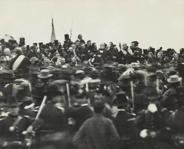 U.S. President Abraham Lincoln (without Hat below Flag slightly right) Standing Amongst Crowd during Dedication of Soldier's National Cemetery where he Delivered his Famous Speech, the Gettysburg Addr...