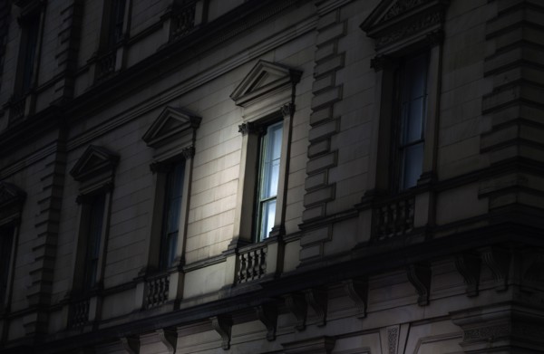 Spotlight on Exterior Window at Night