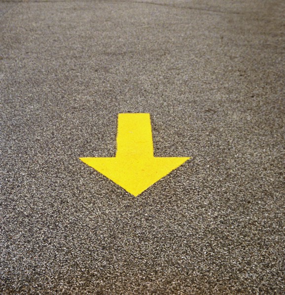 Yellow Arrow on Concrete