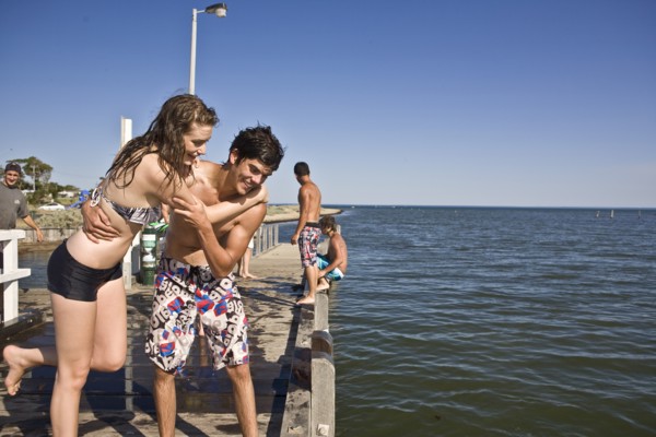 Playful Young Couple on Pier