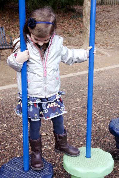Girl Playing at Playground
