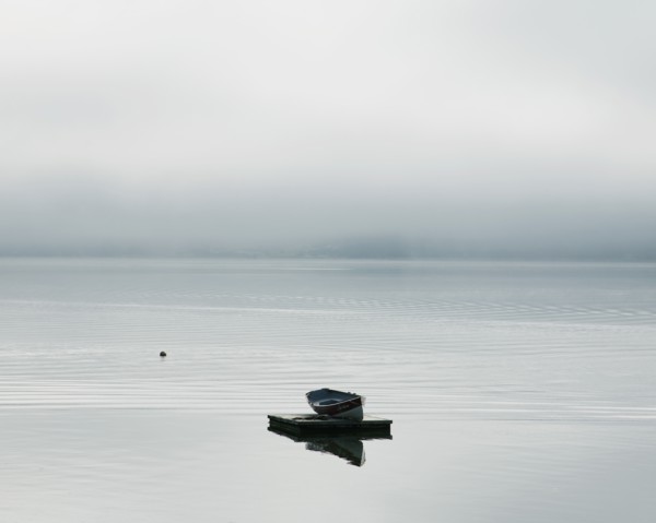 Rowboat Floating on a Dock