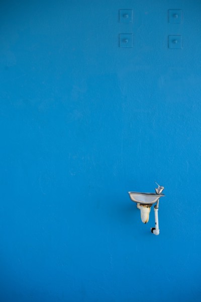 Water Fountain Against Blue Wall