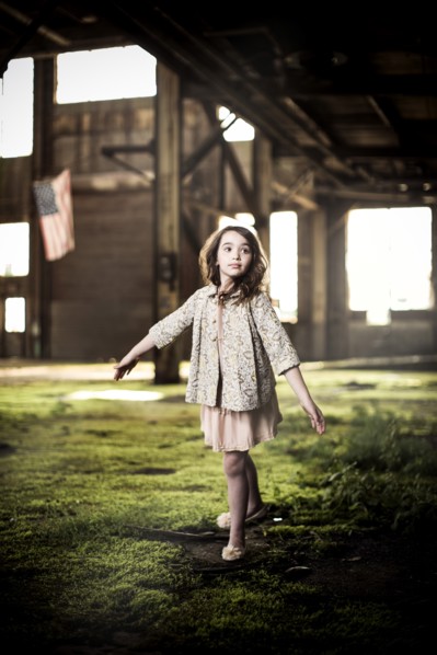 Young Girl Dancing in Abandoned Warehouse