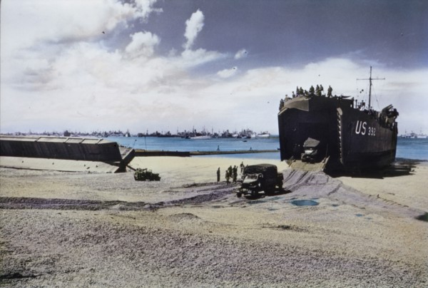 Trucks Exit From The Hold Of A US Naval LST on Beach After Storm Wrecked Artificial Mulberry Harbors, Normandy, France, June 1944