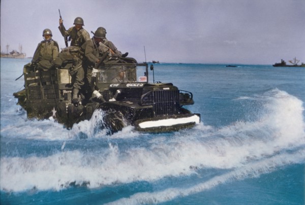 U.S. Military Truck with Soldiers driving through water toward shore during Invasion of Normandy, France, June 1944
