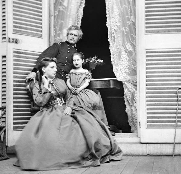 Gen. Edward O.C. Ord, wife and child at the residence of Jefferson Davis, In doorway is  table on which the Surrender of Gen. Robert E. Lee was Signed, Richmond, Virginia, USA, April 1865