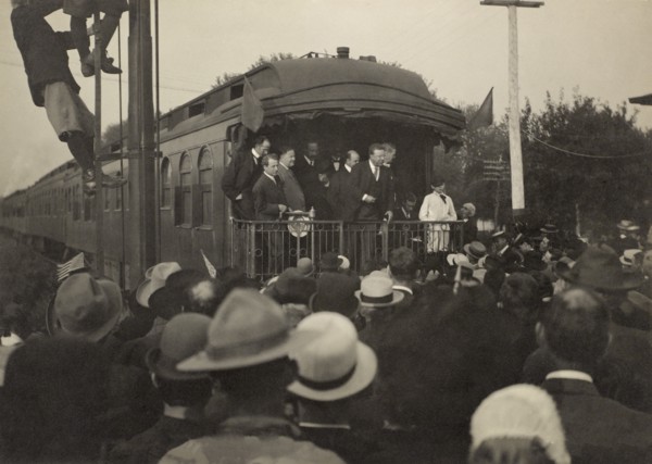 Former President Theodore Roosevelt Greeting Crowd from Back of Railroad Car, Baldwin, Kansas, USA, Photograph by A. Bridwell, August 31, 1910