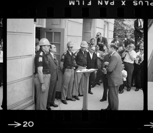Governor George Wallace attempting to block Integration by standing defiantly at Door while being confronted by Deputy U.S. Attorney General Nicholas Katzenbach, University of Alabama, Tuscaloosa, Ala...