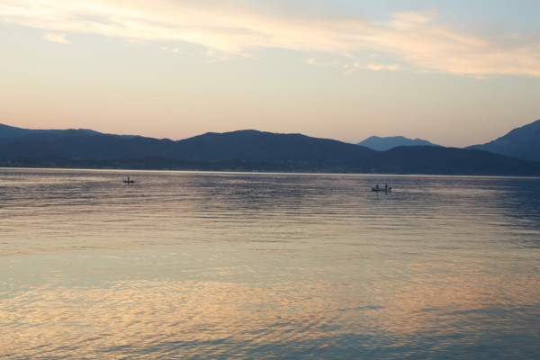 Fishermen at Dusk with Mountainous Landscape in Background, Patras, Greece