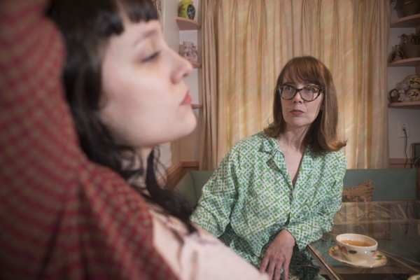 Two Women in Nightwear having a Serious Discussion