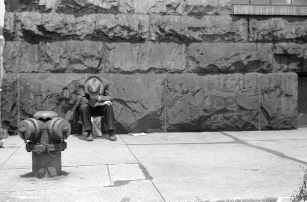 Man seated on Corner of Jefferson Street and Vernon Park Place
