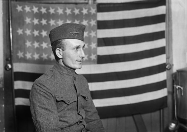 Half-Length Portrait of American Soldier with American Flag in Background