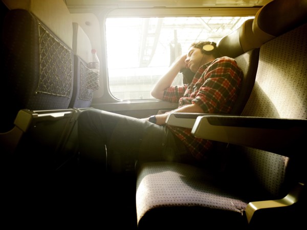 Young Man asleep on Train