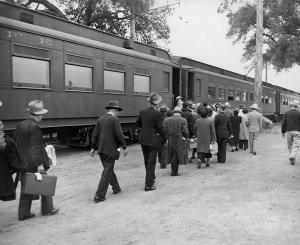Evacuees boarding Special Train at Assembly Center enroute to a War Relocation Center