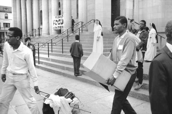 African American Men carrying Supplies from Food Distribution Center at Church after Riots following Dr. Martin Luther King Jr's, Assassination, 1968