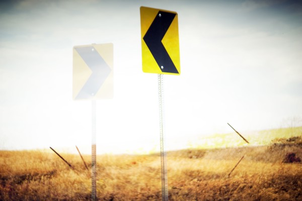 Directional Road Signs in Rural Landscape,,