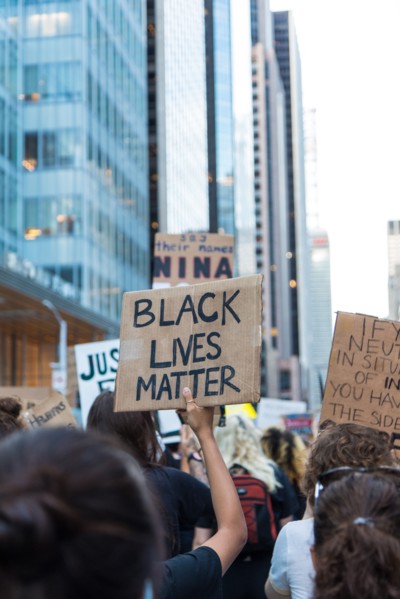 Protester holding up Black Lives Matter Sign during Juneteenth March, Midtown,