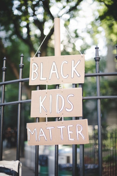 Black Kids Matter Sign Hanging on Metal Fence, New York City,