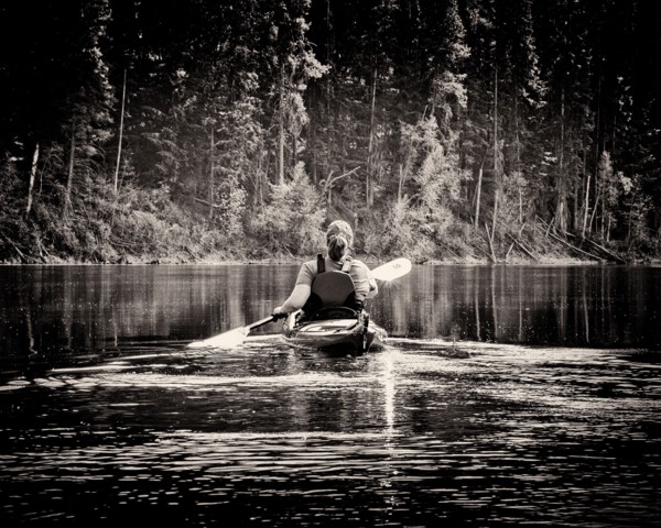 Rear View of Woman Kayaking,,