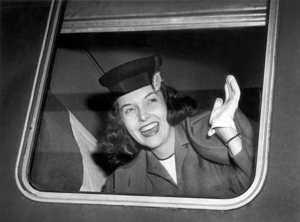 American Actress Shirley Molohon waving Goodbye as she departs Chicago for Hollywood and work in International's "Dark Mirror"